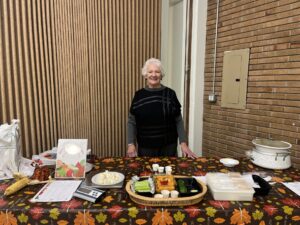 Women standing infront of a table