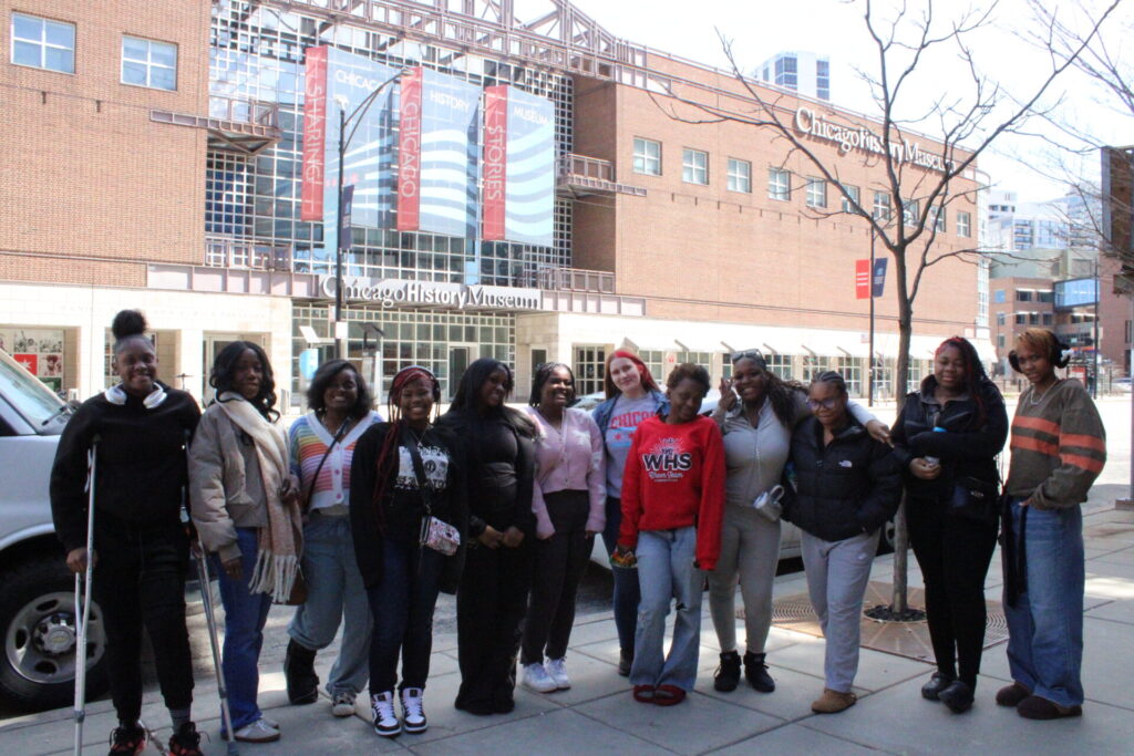 Girls Club poses for a picture outside the Chicago History Museum