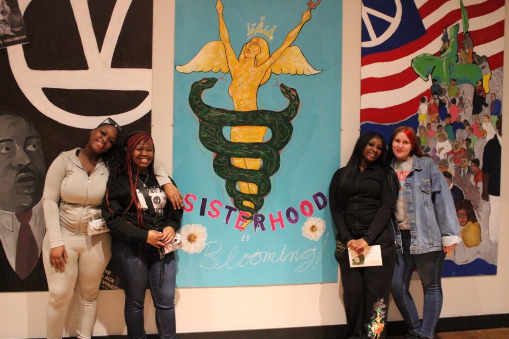 Four girls posing for a picture.